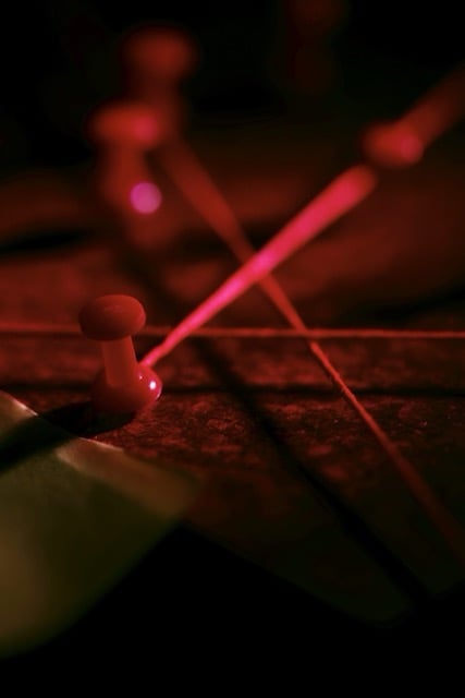 Red string crossing over, pin board. Red push pins. The corner of a piece of paper. Close up. Moody photo. --ar 2:3 --sref 2543085458 --v 8.2 Job ID: 291d62aa-6c15-45f0-82fb-74ccf651c0fd