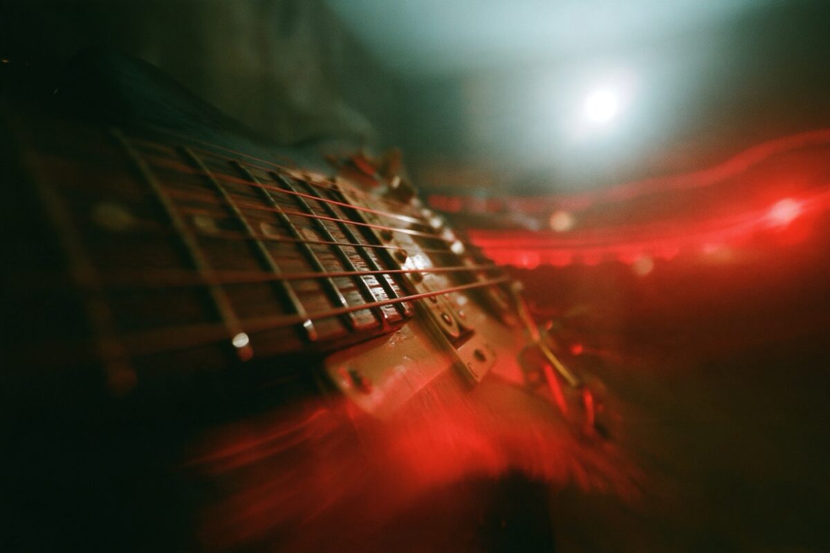Close up on electric guitar strings. The room is dark, lights off, but the guitar is lit by a soft red light --ar 3:2 --sref 3009857884 --hd --v 8.2 Job ID: 2fc1659e-47a8-49a4-b58b-c63481d4e104